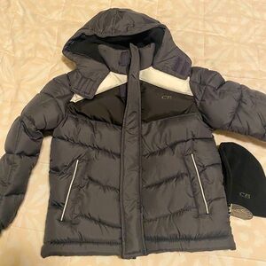 New with tags boys hooded rain jacket with beanie. Size 5-6.